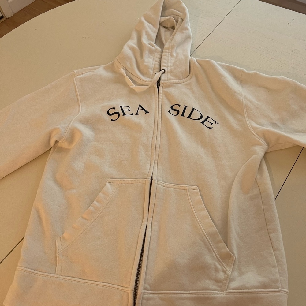 Seaside beach white zip up with navy writting size medium hardly worn